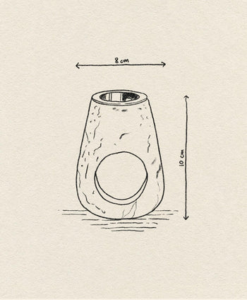 A hand-drawn sketch of the stillgoods Eli Oil Burner, a cylindrical essential oil diffuser by stillgoods with a large circular side opening, rough texture details, and labeled measurements showing its 8 cm width and 10 cm height.