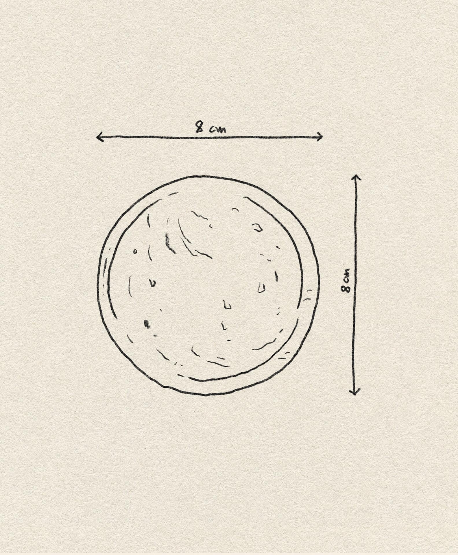 The stillgoods Luna Dish, shown as a hand-drawn circle with arrows indicating its 8 cm diameter on a textured beige background, is the perfect catch-all or mini trinket dish to organize your space.