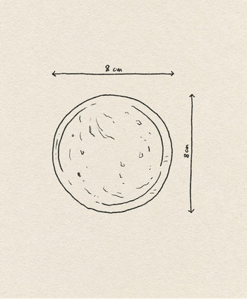 The stillgoods Luna Dish, shown as a hand-drawn circle with arrows indicating its 8 cm diameter on a textured beige background, is the perfect catch-all or mini trinket dish to organize your space.